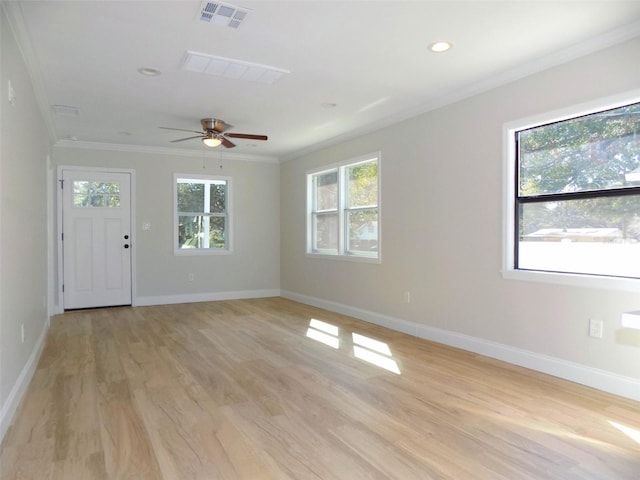 empty room with visible vents, plenty of natural light, baseboards, and ceiling fan