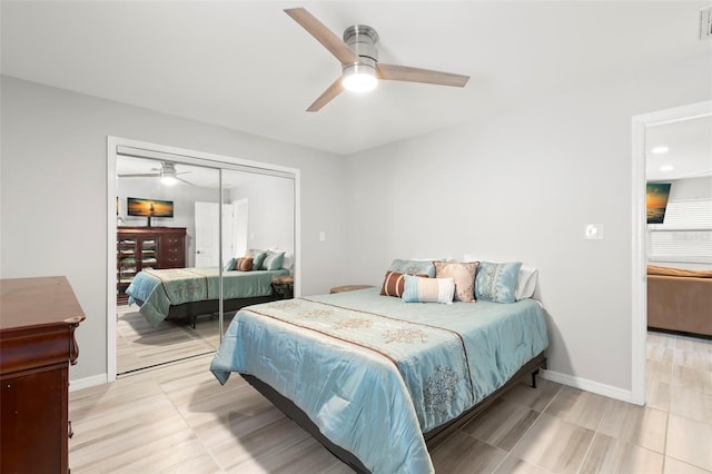 bedroom featuring ceiling fan, visible vents, baseboards, and a closet