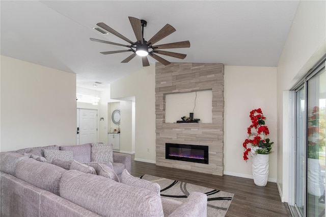 living area with a large fireplace, baseboards, a ceiling fan, dark wood-style floors, and vaulted ceiling