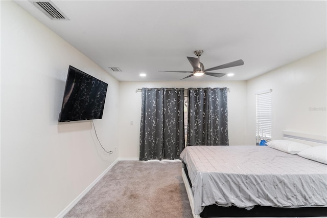 bedroom with a ceiling fan, baseboards, visible vents, and carpet flooring