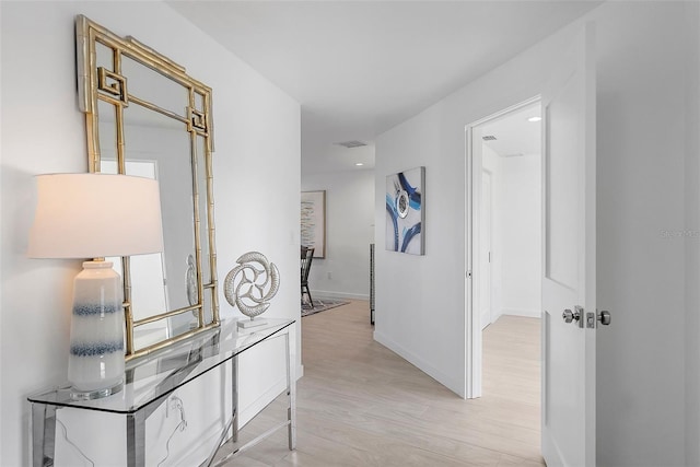 1984 Kansas Ave NE, Saint Petersburg, FL 33703 - corridor featuring light wood-type flooring and baseboards