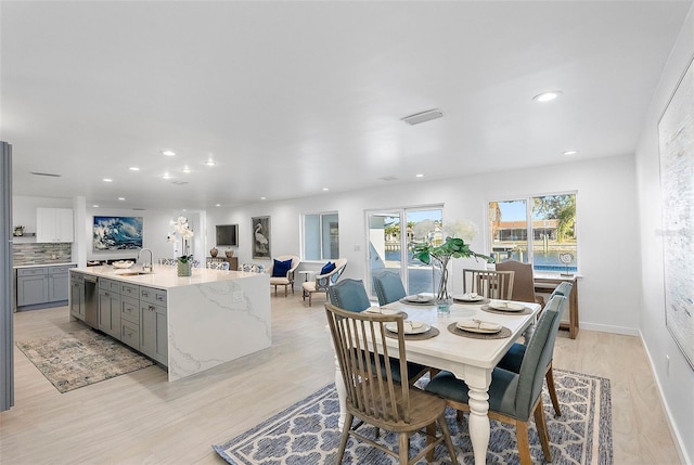1984 Kansas Ave NE, Saint Petersburg, FL 33703 - dining room featuring baseboards, visible vents, light wood-style flooring, and recessed lighting
