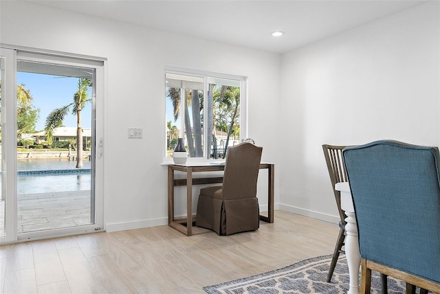 1984 Kansas Ave NE, Saint Petersburg, FL 33703 - dining room with light wood-style flooring, baseboards, and recessed lighting