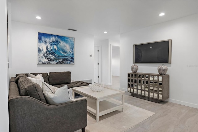 1984 Kansas Ave NE, Saint Petersburg, FL 33703 - living room with baseboards, light wood finished floors, visible vents, and recessed lighting