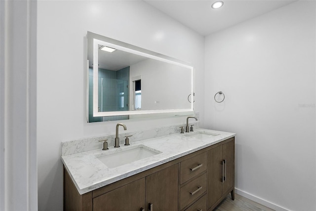 1984 Kansas Ave NE, Saint Petersburg, FL 33703 - full bath with recessed lighting, a sink, baseboards, and double vanity