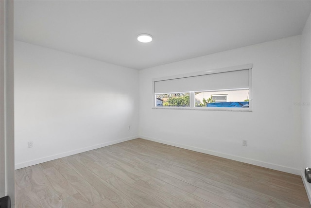 1984 Kansas Ave NE, Saint Petersburg, FL 33703 - unfurnished room with light wood finished floors and baseboards