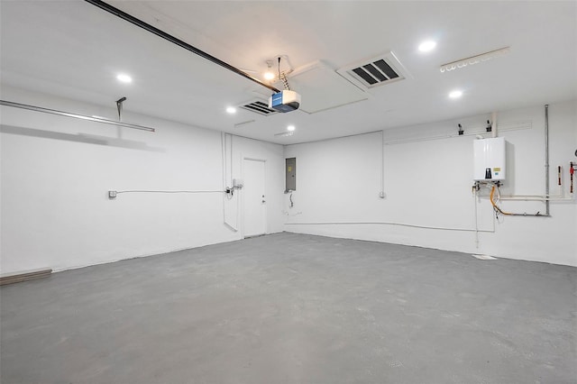 1984 Kansas Ave NE, Saint Petersburg, FL 33703 - garage featuring a garage door opener, electric panel, visible vents, and water heater