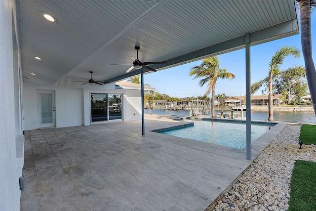 1984 Kansas Ave NE, Saint Petersburg, FL 33703 - outdoor pool featuring a water view, a ceiling fan, and a patio