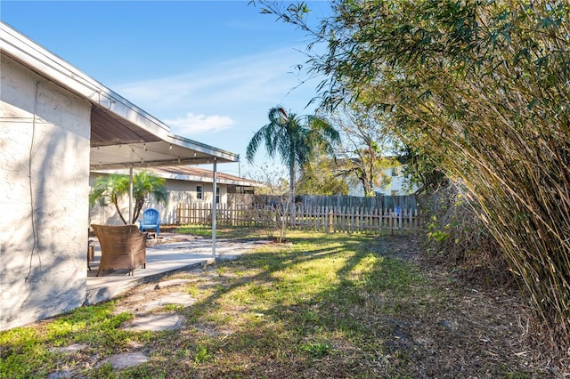 view of yard featuring a patio area and fence