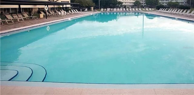community pool featuring a patio area