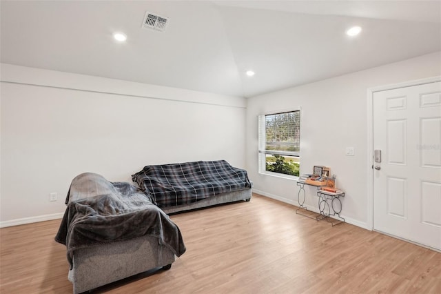 living area with light wood finished floors, baseboards, visible vents, lofted ceiling, and recessed lighting