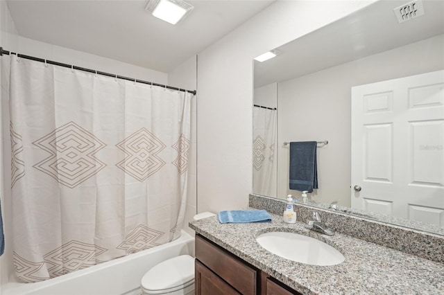 full bath with visible vents, toilet, shower / bath combo with shower curtain, and vanity