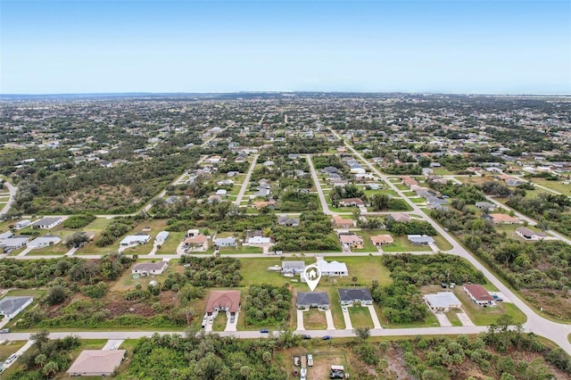 birds eye view of property with a residential view