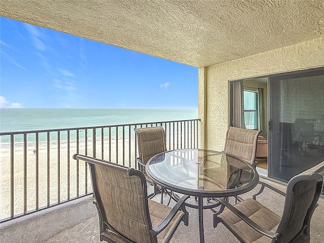 balcony with a view of the beach and a water view