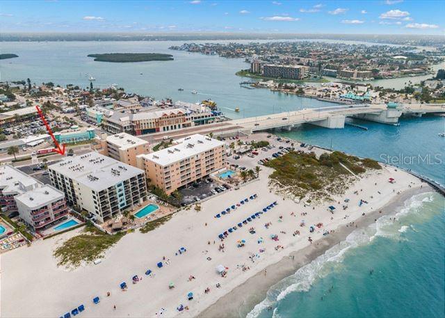 bird's eye view featuring a view of city, a beach view, and a water view