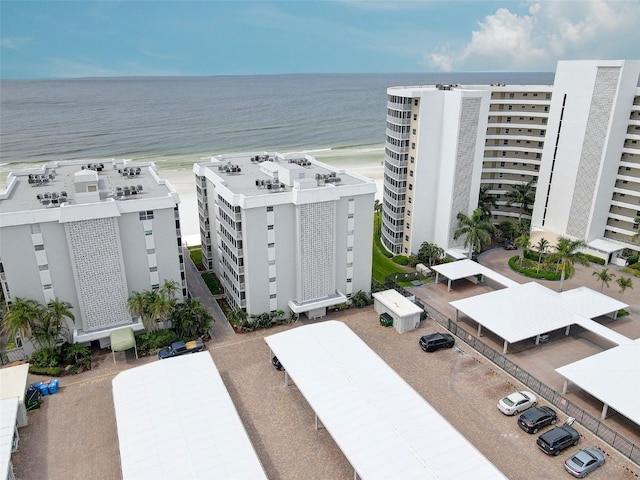 birds eye view of property with a view of the beach and a water view