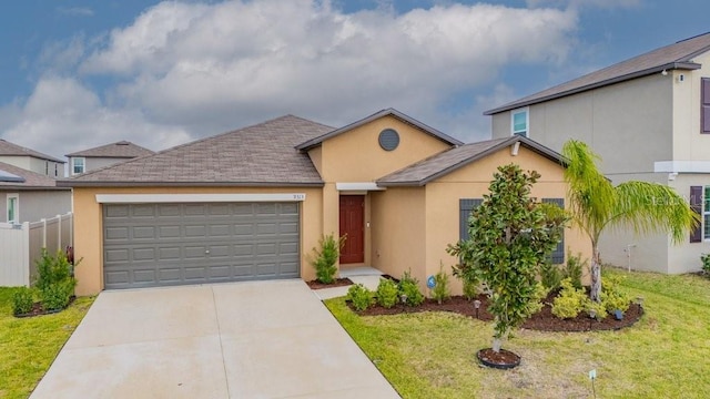 ranch-style house with a front yard, driveway, an attached garage, and stucco siding