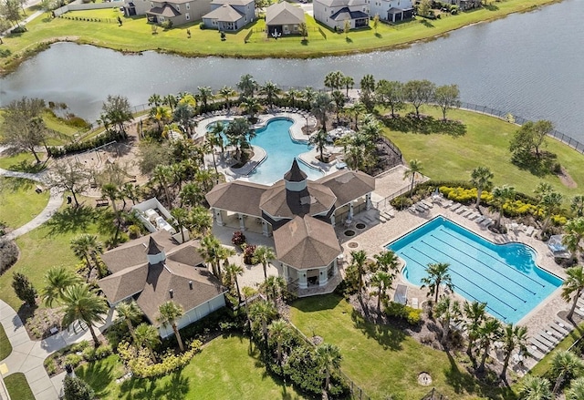 drone / aerial view with a water view and a residential view