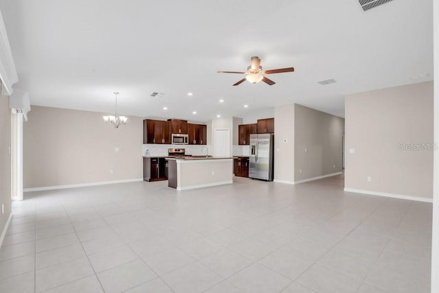 unfurnished living room with recessed lighting, a sink, baseboards, and ceiling fan with notable chandelier