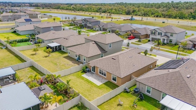 bird's eye view featuring a residential view and a water view