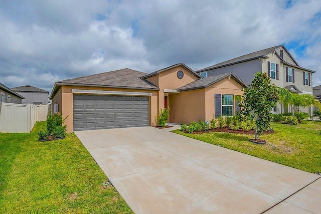 traditional-style home featuring a front yard, fence, an attached garage, and stucco siding