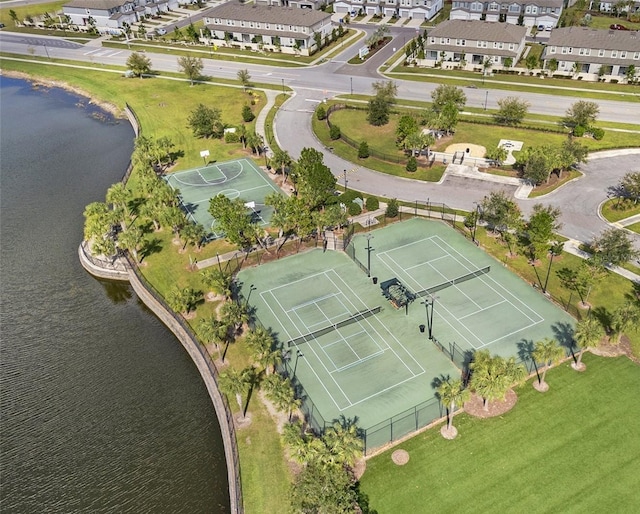 bird's eye view featuring a water view and a residential view