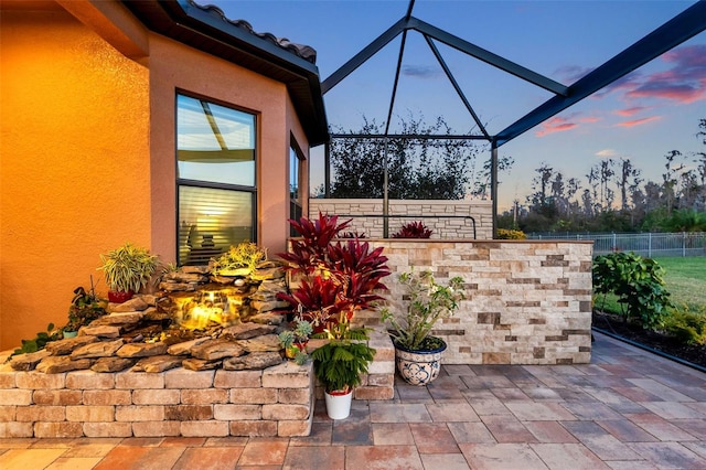 patio terrace at dusk with a lanai