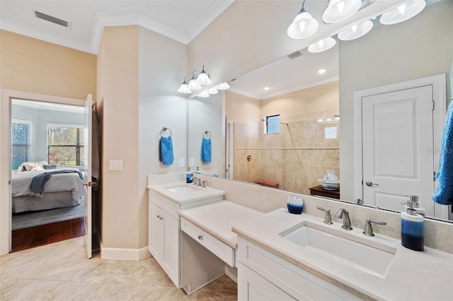 full bathroom featuring visible vents, ornamental molding, a sink, and ensuite bathroom