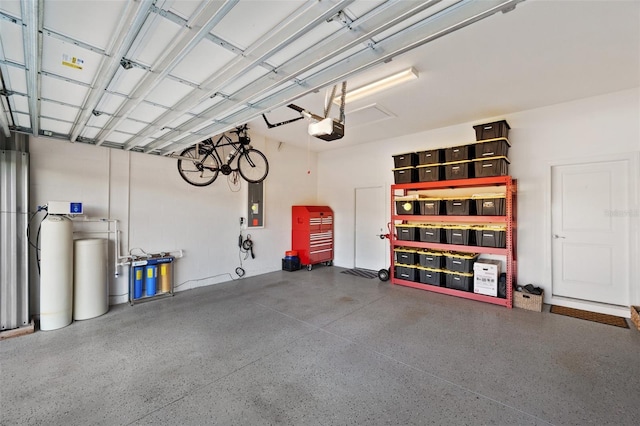 garage featuring a garage door opener and electric panel