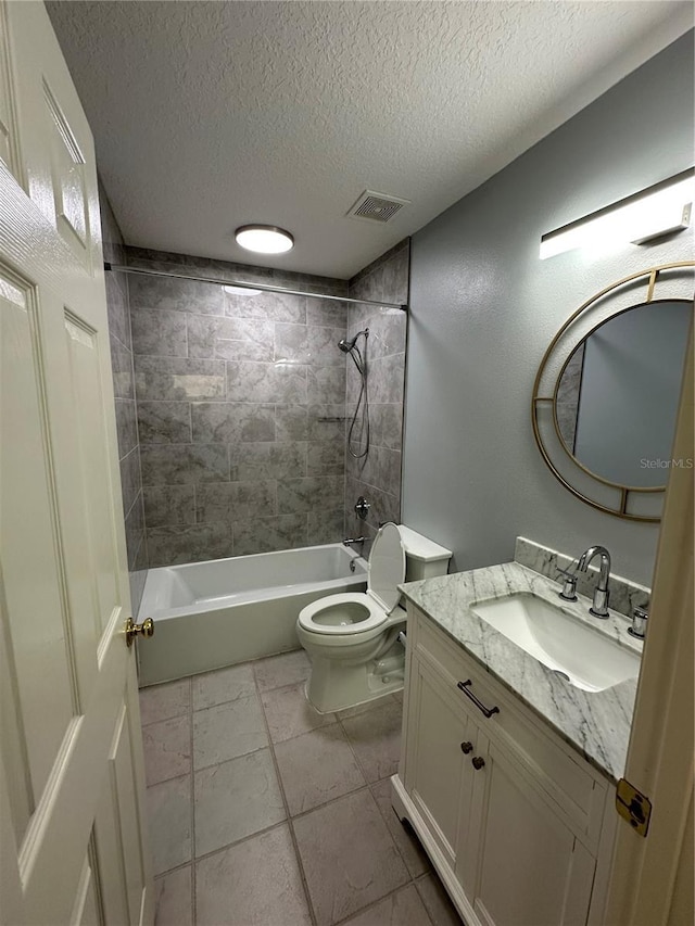 bathroom with a textured ceiling, vanity, visible vents, toilet, and shower / bath combination