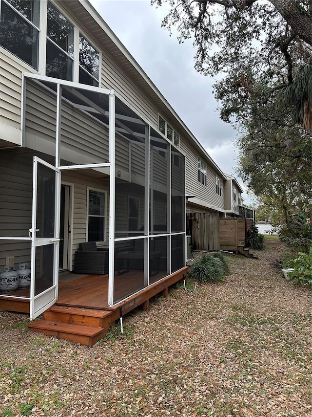 back of house with a sunroom