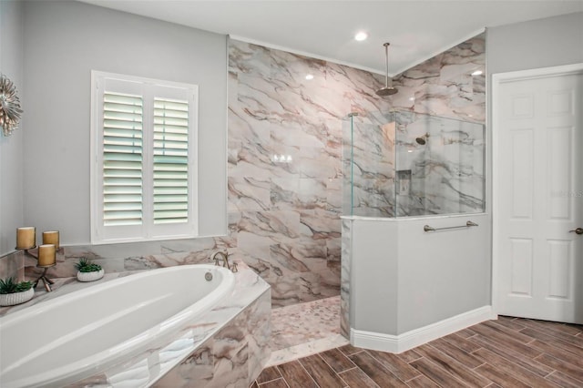 full bathroom with a bath, a marble finish shower, and wood finish floors