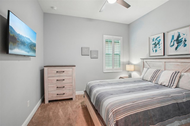 carpeted bedroom with baseboards and ceiling fan