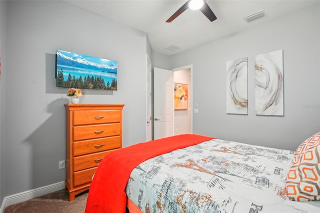 carpeted bedroom featuring visible vents, a ceiling fan, and baseboards