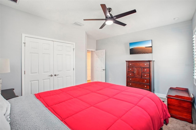 bedroom featuring a closet, baseboards, a ceiling fan, and carpet floors