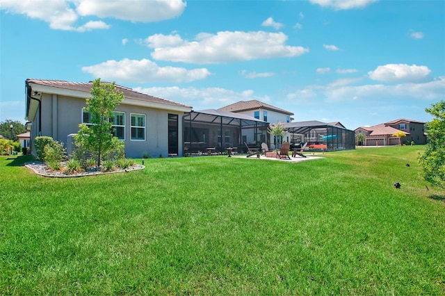 view of yard with a lanai and a patio