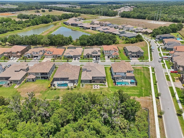 birds eye view of property featuring a residential view and a water view