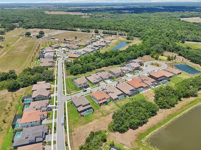 bird's eye view featuring a residential view and a water view