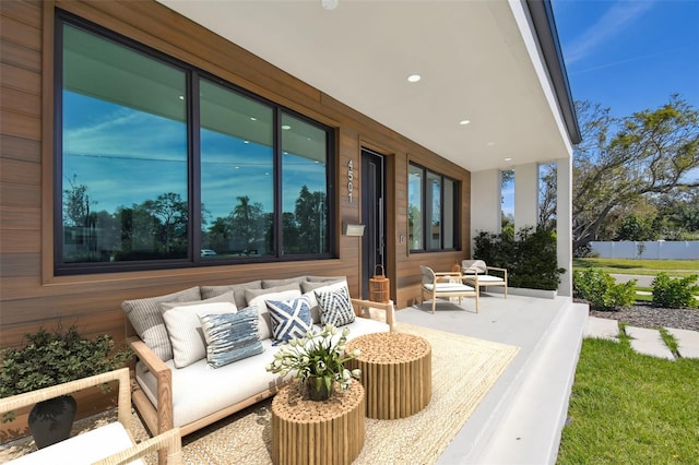 view of patio with fence and an outdoor living space