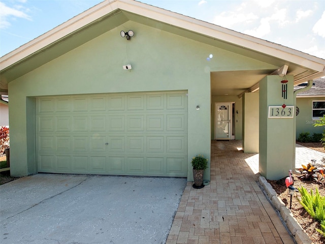 garage with concrete driveway