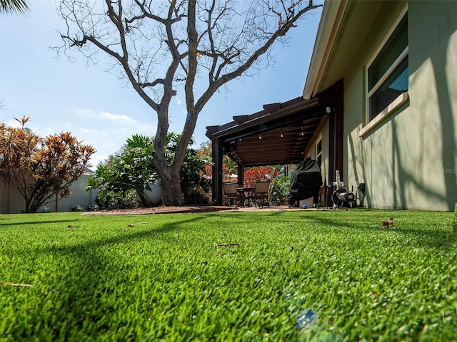 view of yard with a patio area and fence