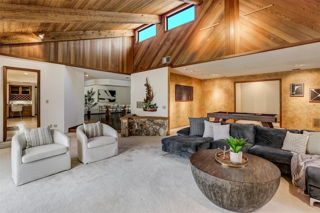 living area with wood ceiling, visible vents, beamed ceiling, and carpet flooring