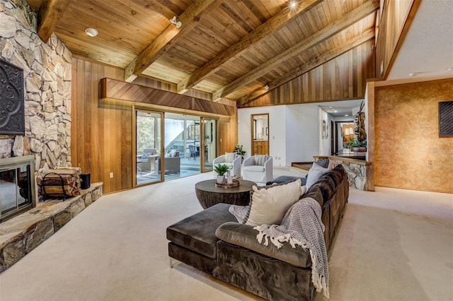 living area featuring light carpet, wooden walls, and a fireplace