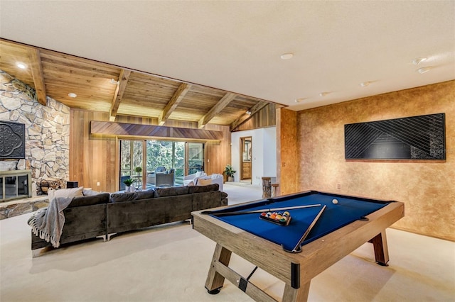 rec room with light carpet, beamed ceiling, a stone fireplace, and billiards