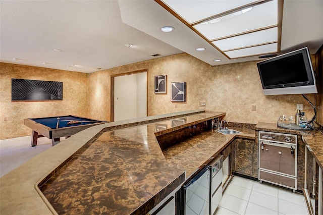 interior space with light tile patterned floors, recessed lighting, a sink, visible vents, and dishwasher