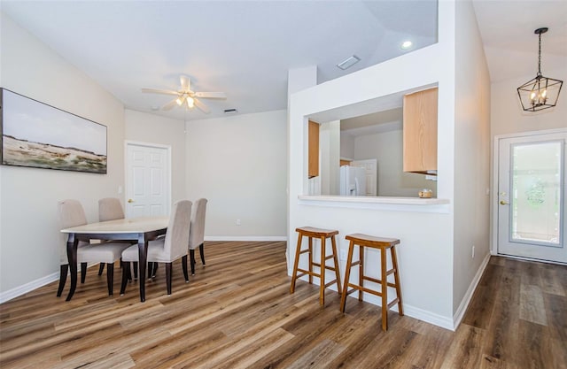 18186 Sandy Pointe Dr, Tampa, FL 33647 - dining room featuring baseboards and wood finished floors