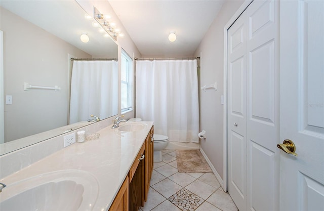 18186 Sandy Pointe Dr, Tampa, FL 33647 - bathroom with toilet, a sink, double vanity, and tile patterned flooring