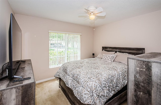 18186 Sandy Pointe Dr, Tampa, FL 33647 - bedroom with baseboards, carpet floors, a textured ceiling, and a ceiling fan