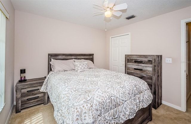 18186 Sandy Pointe Dr, Tampa, FL 33647 - bedroom with baseboards, carpet, a closet, and visible vents