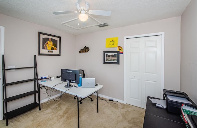 18186 Sandy Pointe Dr, Tampa, FL 33647 - home office with baseboards, a textured ceiling, visible vents, a ceiling fan, and light carpet